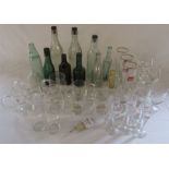 Various advertising drinking glasses inc Guinness together with local bottles inc Cuthberts Louth,