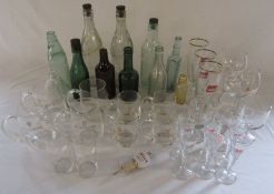 Various advertising drinking glasses inc Guinness together with local bottles inc Cuthberts Louth,