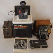 4 vintage cameras including a Polaroid Super Swinger & a Puck