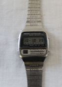 Vintage steel cased Seiko calculator wristwatch with digital dial on bracelet strap, the back