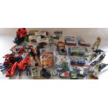 Box of assorted toys inc Action Man, Top Trumps, dinosaurs, die cast cars etc