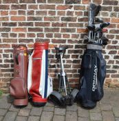 Various golf club, bags and a trolley