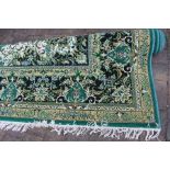 Large jute carpet on green ground approx. size 4m by 3m