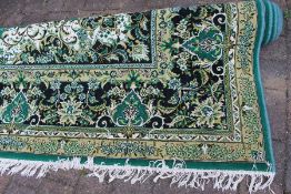 Large jute carpet on green ground approx. size 4m by 3m