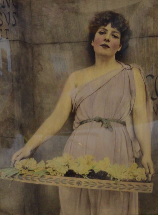 Large early 20th century crystoleum of a young lady in classical dress with a tray of flowers. Frame