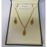 Boxed 9ct gold emerald and diamond pendant and earrings on a 9ct gold chain, chain length 46 cm,