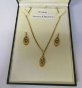 Boxed 9ct gold emerald and diamond pendant and earrings on a 9ct gold chain, chain length 46 cm,