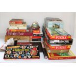 Selection of board games including Monopoly, rubik's cubes, jigsaw puzzles, Camberwick Green