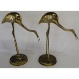 Pair of decorative brass storks holding fish, 45cm high