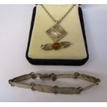 Silver bracelet 0.51 ozt L 7.5", silver and amber brooch 0.07 ozt L 3 cm & a silver bird pendant and