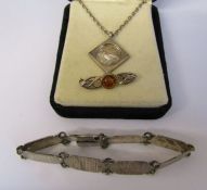 Silver bracelet 0.51 ozt L 7.5", silver and amber brooch 0.07 ozt L 3 cm & a silver bird pendant and