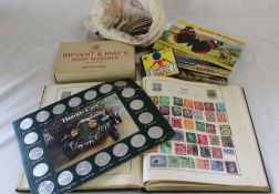 Small stamp album containing World stamps, box of Bryant & May's book matches, Brooke Bond picture