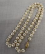 Mikimoto cultured pearl necklace with gold bauble clasp marked 750, drop length 46cm