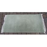 Rangek olive green wool rug 75 cm x 150 cm