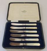 Cased set of Walker & Hall silver and mother of pearl butter knives, Sheffield 1918