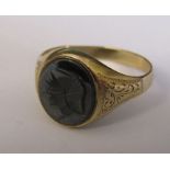 9ct gold ring hematite intaglio ring with centurion decoration size T weight 2.9 g