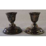 Pair of small silver candlesticks with loaded bases Birmingham 1922