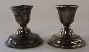 Pair of small silver candlesticks with loaded bases Birmingham 1922