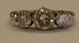 18ct gold & platinum diamond trilogy ring, central stone 0.75ct flanked by two 0.35ct diamonds (1.