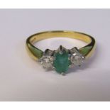 18ct gold emerald and diamond ring, each diamond approximately 0.20 ct, size P, total weight 3.3 g