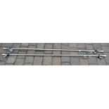 Pair of large modern steel curtain poles from Lees of Grimsby