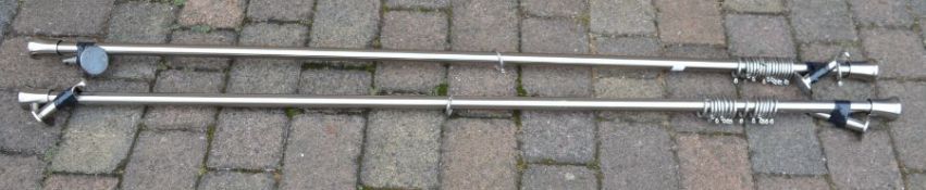 Pair of large modern steel curtain poles from Lees of Grimsby