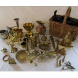 Assorted brassware etc inc shell cases, miniature candlesticks, fly ashtray in a wicker basket