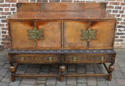 Early 20th century carved oak & leather top sideboard on turned legs with brass embellishments H