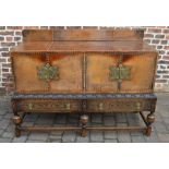 Early 20th century carved oak & leather top sideboard on turned legs with brass embellishments H