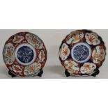 2 Imari pattern plates, with bat pattern on the reverse of one, 21cm dia.