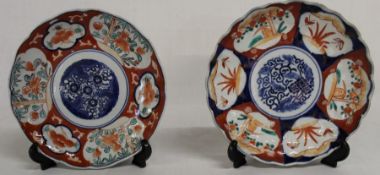 2 Imari pattern plates, with bat pattern on the reverse of one, 21cm dia.