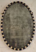 An Irish 18th century style oval mirror with faceted glass bead frame 61cm by 41cm