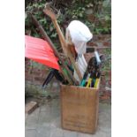 Selection of garden tools in an old tea chest