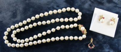 Cultured pearl necklace comprising 73 evenly matched pearls with an 18ct gold diamond, ruby and