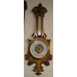 Ornately carved late 19th century oak aneroid barometer Ht 90cm