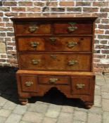 Queen Anne walnut chest on stand on bun feet with walnut veneer with feather banding to top &