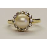 18ct gold diamond cluster ring with central pearl, weight 6.1g size M