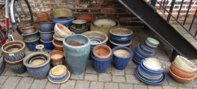 Large quantity of approximately 50 garden planters & assorted saucers