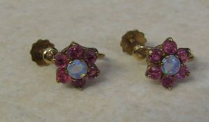 Pair of 9ct gold ruby and opal cluster earrings, weight 2.3 g, diameter 10 mm, screw fastening