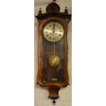 Serpentine fronted Vienna wall clock with spring driven mechanism Ht 103cm