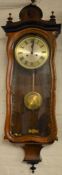 Serpentine fronted Vienna wall clock with spring driven mechanism Ht 103cm