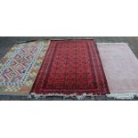 Iranian red ground Balochi rug 195cm by 121cm with 2 others