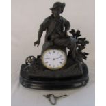 Small French figural mantel clock with canon and wooden stand H 34 cm L 31.5 cm