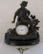 Small French figural mantel clock with canon and wooden stand H 34 cm L 31.5 cm