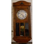 Oak case 1930's wall clock with chiming mechanism