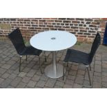 Circular glass top steel table with 2 chairs