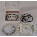 Boxed Pandora bracelet with assorted silver and white metal charms with leather pandora bracelet,