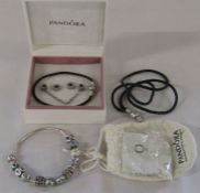 Boxed Pandora bracelet with assorted silver and white metal charms with leather pandora bracelet,