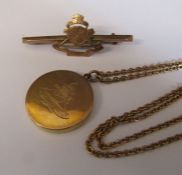 9ct gold Royal Artillery brooch L 5 cm weight 1.9 g and a 9ct gold Royal Artillery locket with