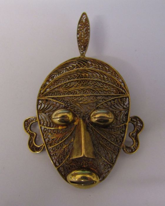 Tested as gold (possibly low grade) filigree mask pendant H 6.5 cm weight 10 g